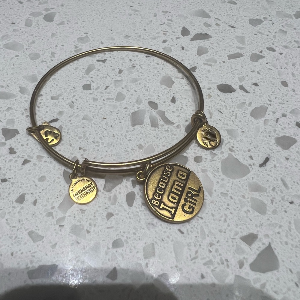 New without tags. Alex and Ani gold charm bracelet “because I’m a girl”
